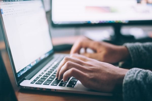 freelancer working on laptop at home